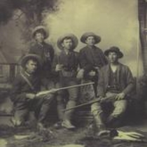 Young Lawrence P. Bass and friends posed as hunters
