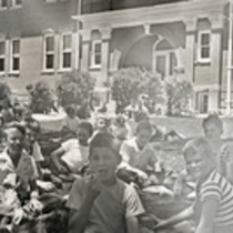School children outside Washington School photographs.