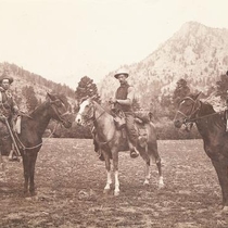 Men horseback riders outside town: Photo 12
