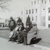 Men on bench outside Boulder County Courthouse: Photo