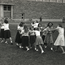 Children playing outside Boulder High School photograph.
