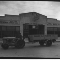 Boulder Clay Products tractor at Ford garage photograph, 1922