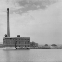Valmont power plant from across lake photograph, 1925