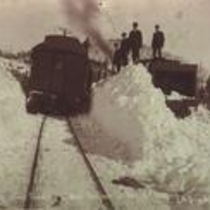 Railroad passenger cars in snow drifts