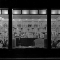 Valentine or Wilson Hardware Store rakes and hoes window display photograph, 1924