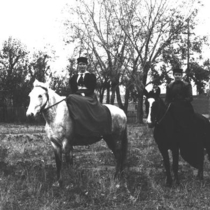 Women horseback riders in town: Photo 1