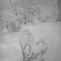 Chair covered in snow